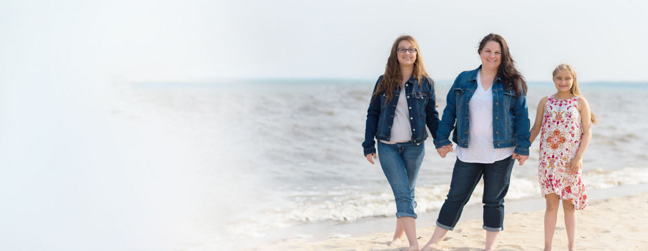 Mother and two daughters at beach