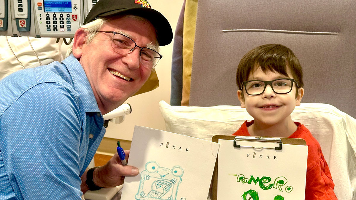 Bob Pauley from Pixar and young patient at Lucile Packard Children's Hospital Stanford