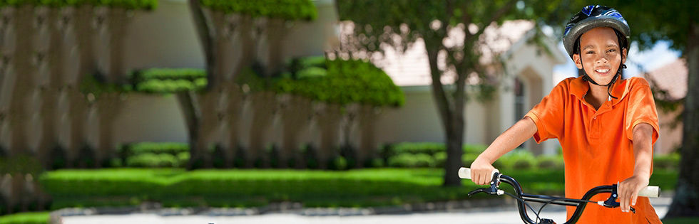 Boy on bike with helmet at Stanford Medicine Children's Health