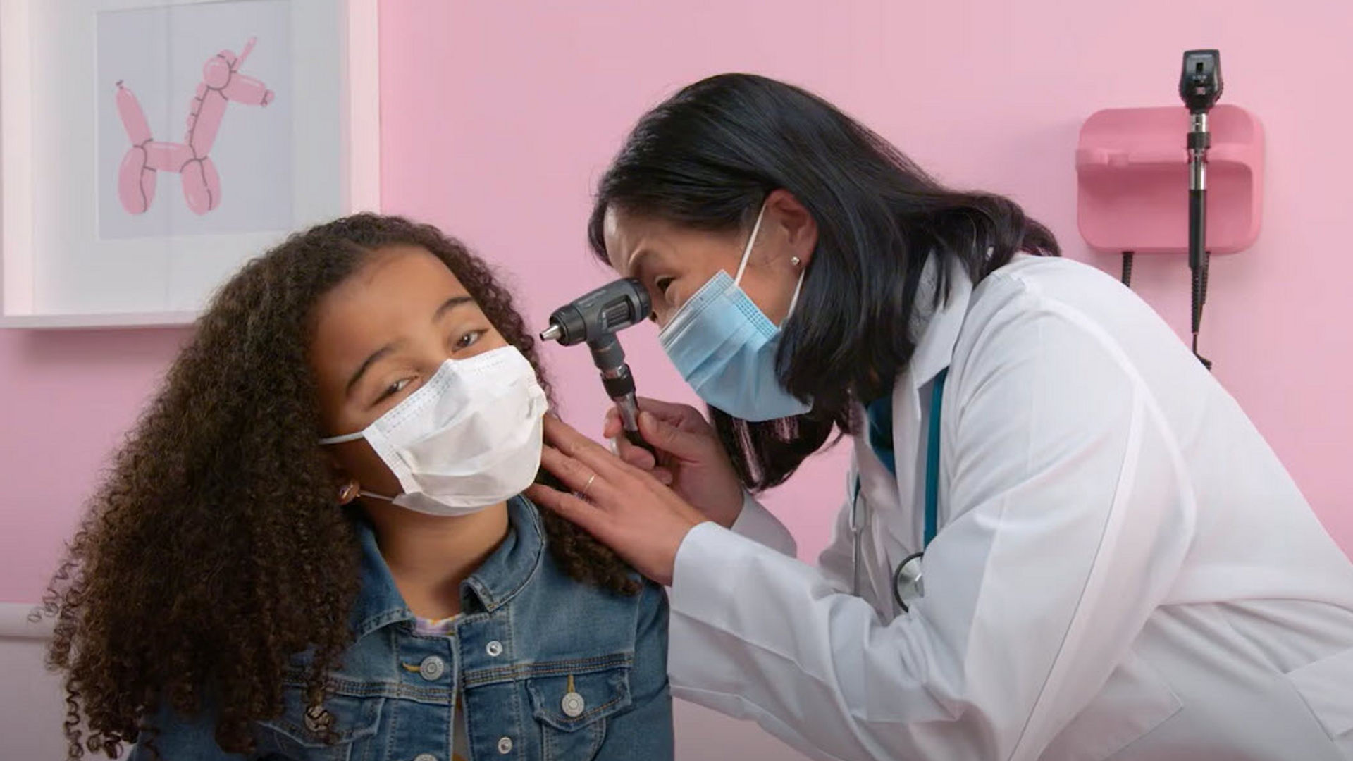 Doctor examining a young patient.