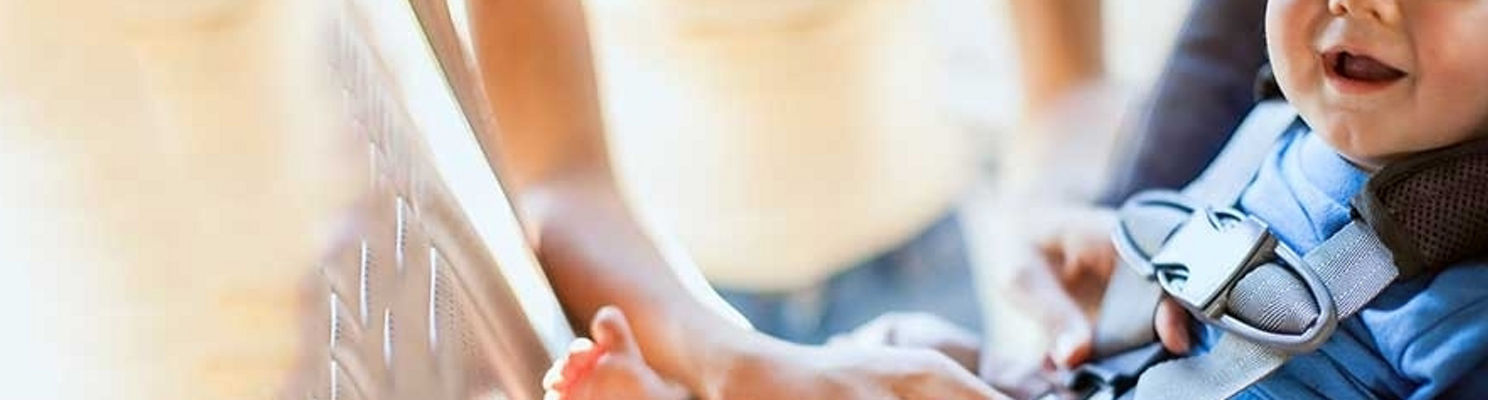 baby being buckled in car seat at Stanford Medicine Children's Health