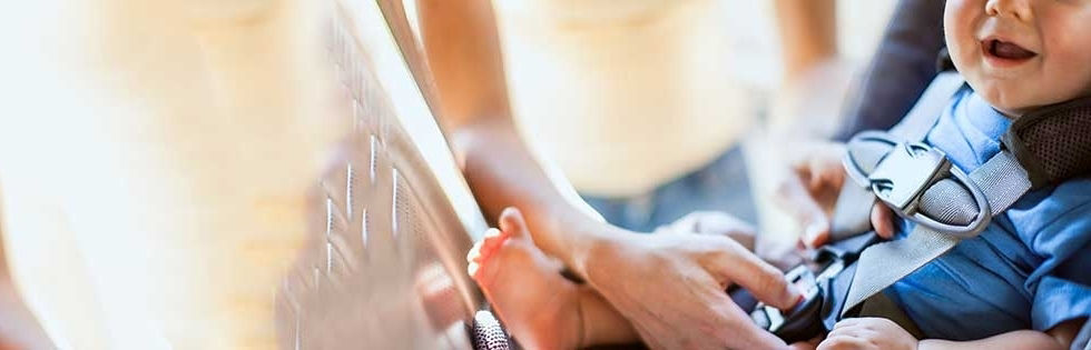 baby being buckled in car seat at Stanford Medicine Children's Health