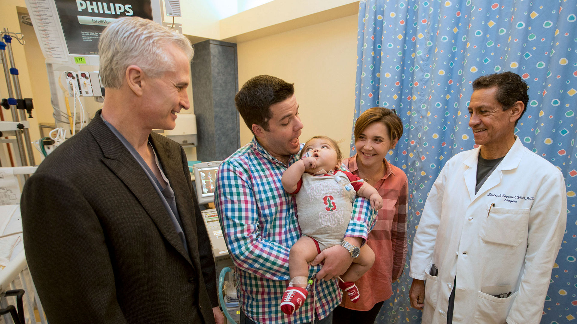 Dr. Frank Hanley and Dr. Carlos Esquivel with Owen Fochler and his parents