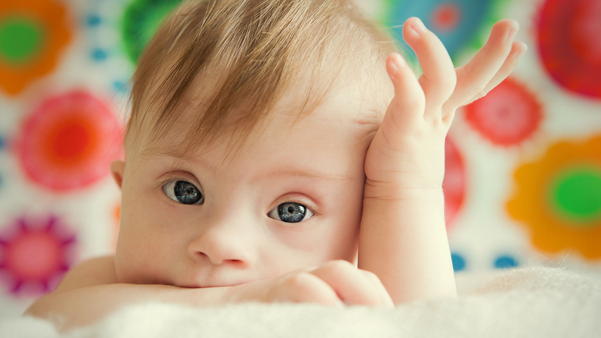 Young baby with colorful background