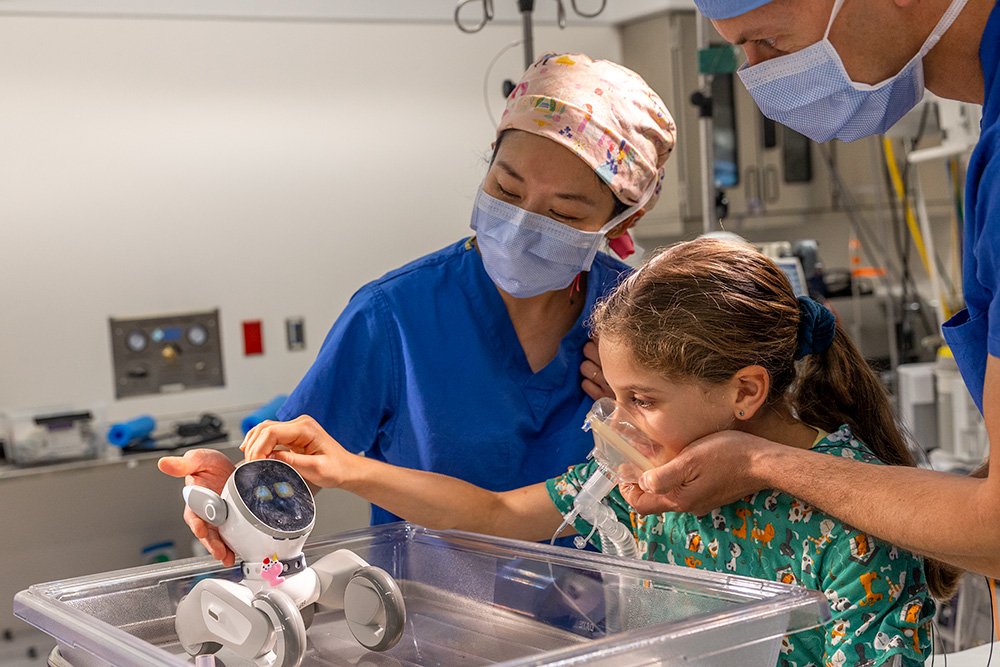 Doctors with patient testing new technology.