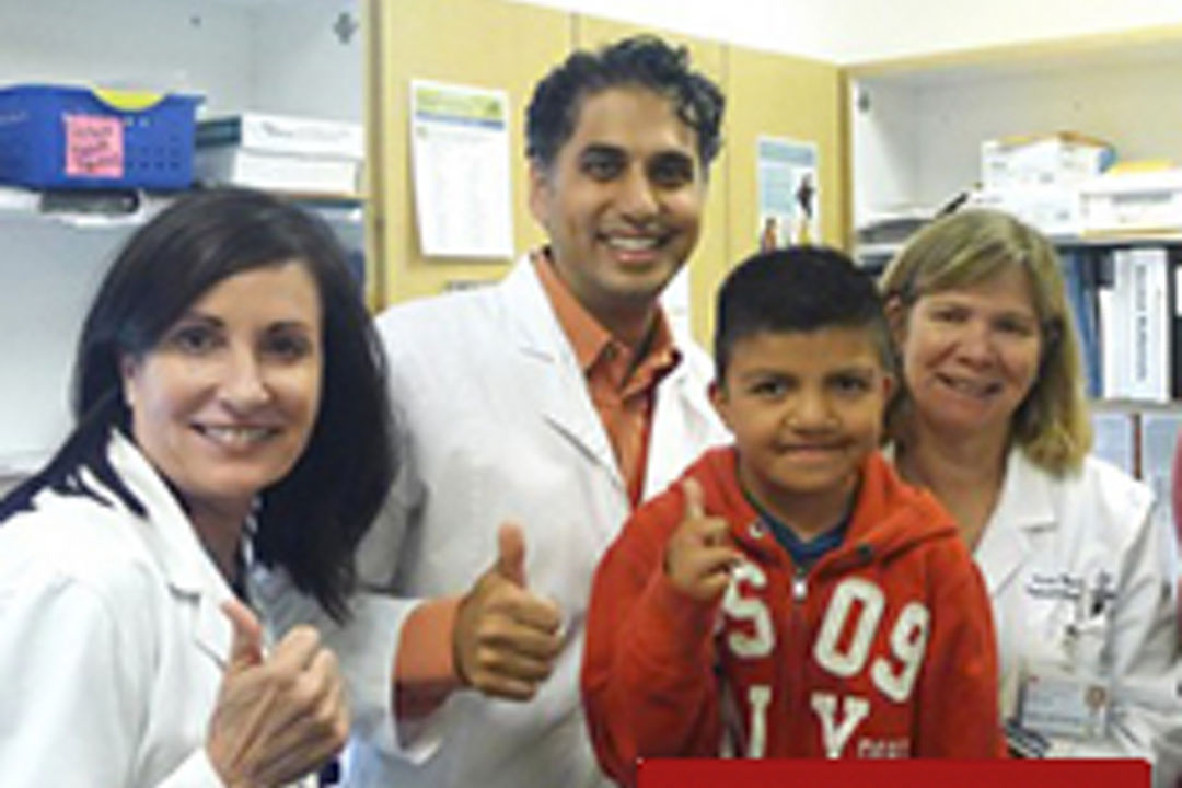 Dr. Kosla and the cleft and craniofacial team with patient
