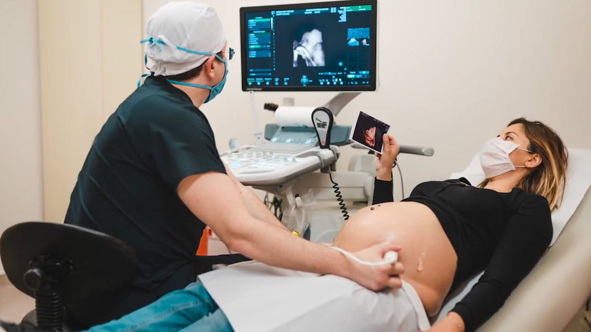 Doctor examining pregnant woman