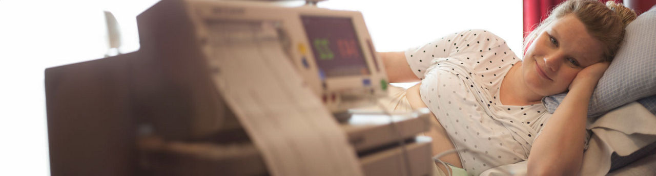 Woman laying on side in hospital gown