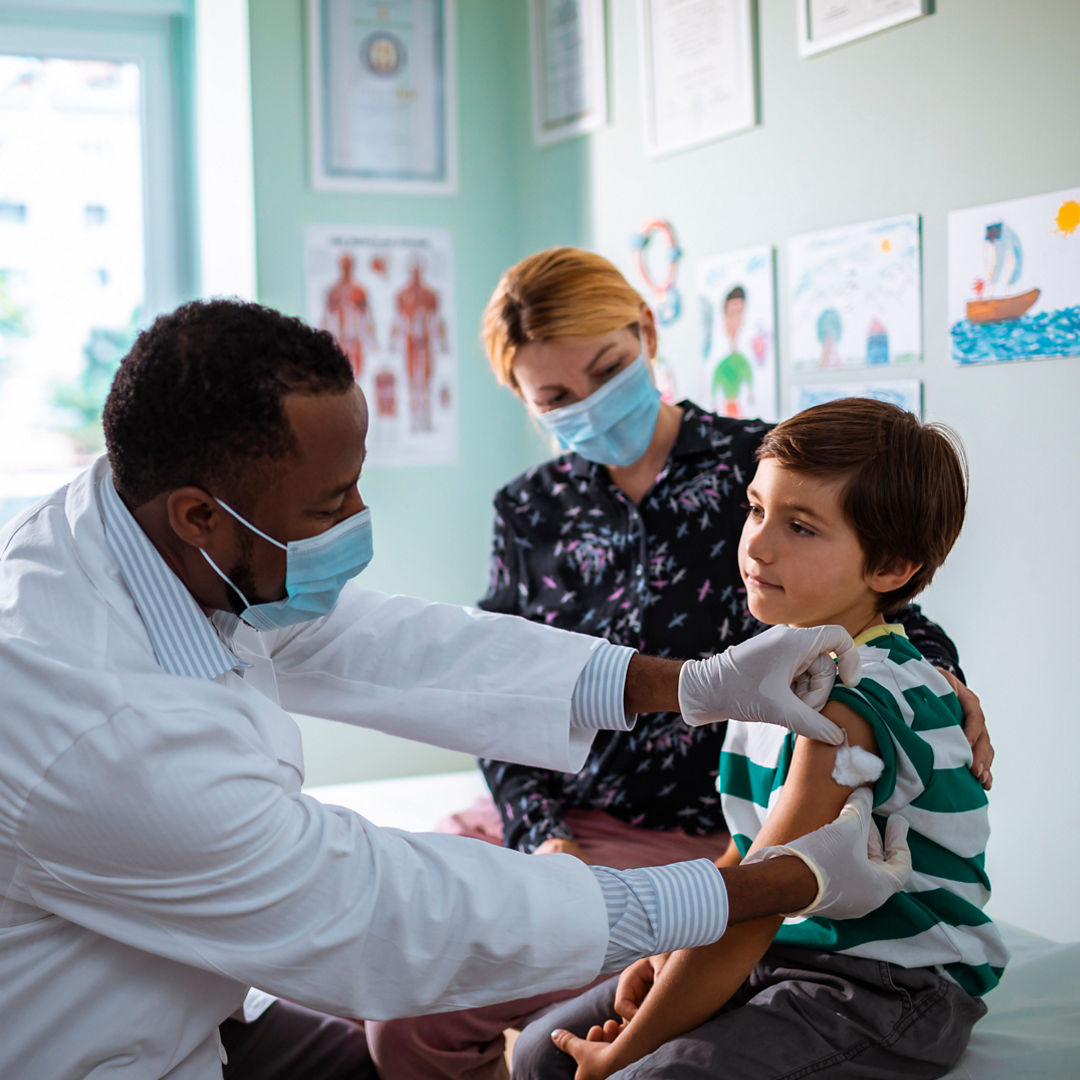 doctor giving child a shot