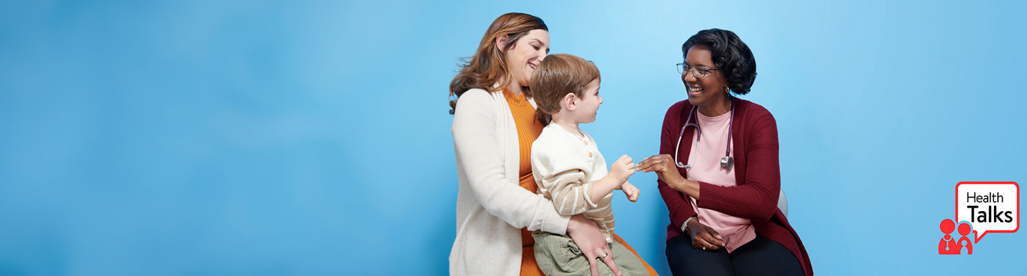 Mother and child interacting with Doctor