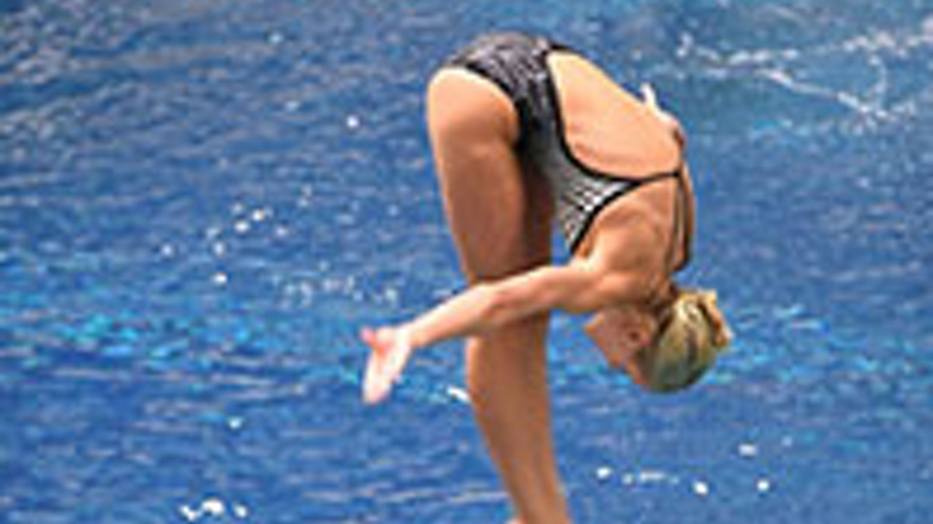 Swimmer diving into the water