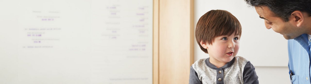 Doctor talking to young boy