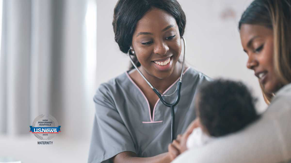 Maternity unit care team member examining a patient