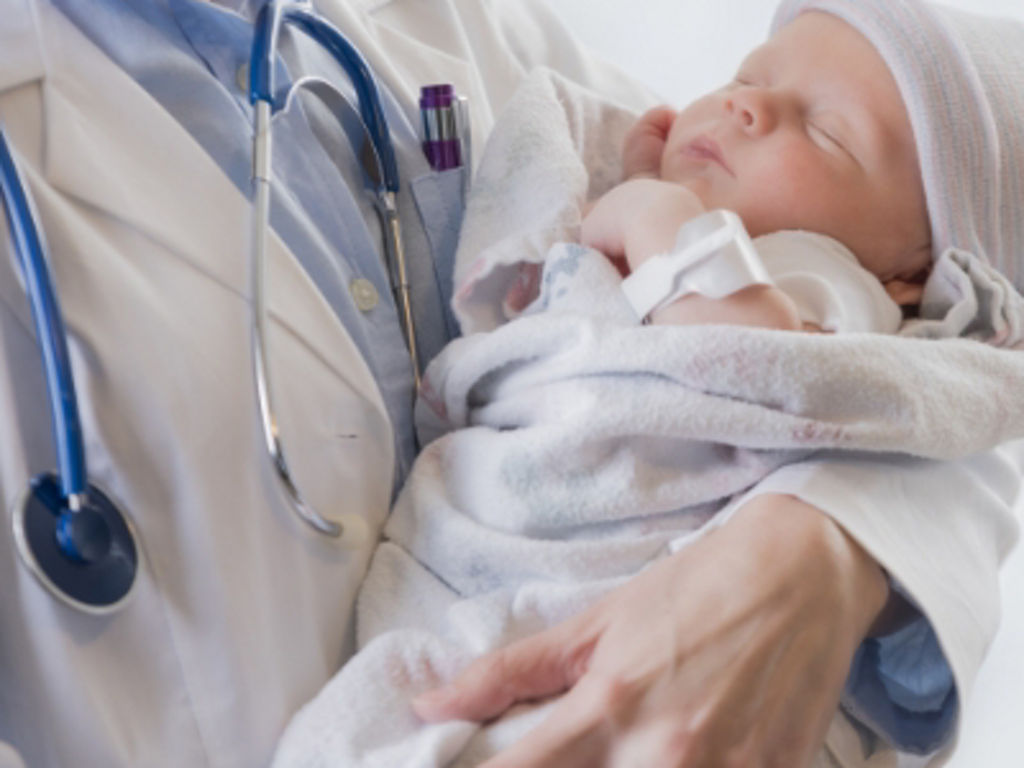 Doctor holding a baby