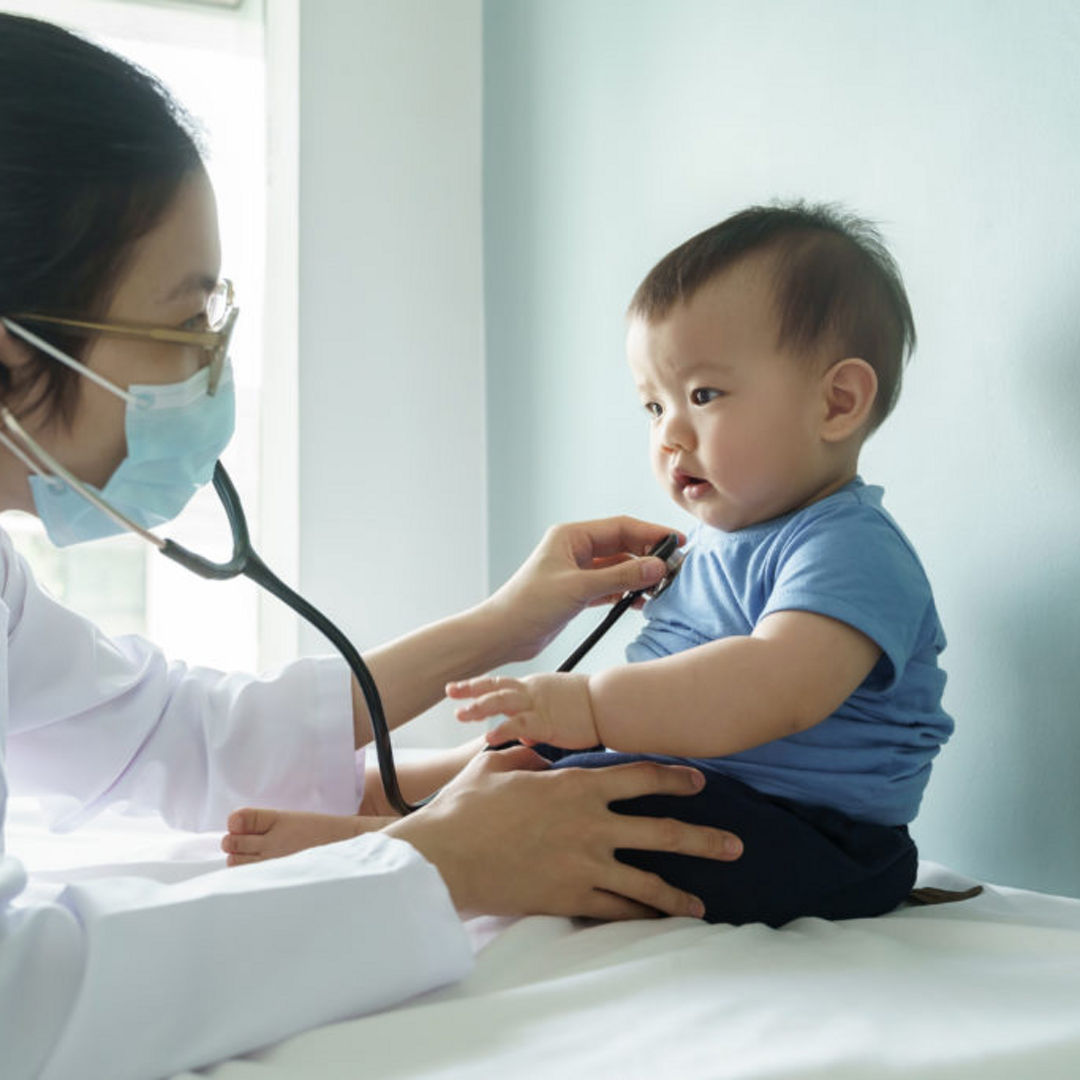 doctor giving child a check up