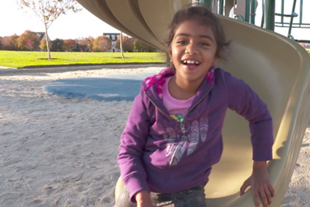 Young girl on a slide