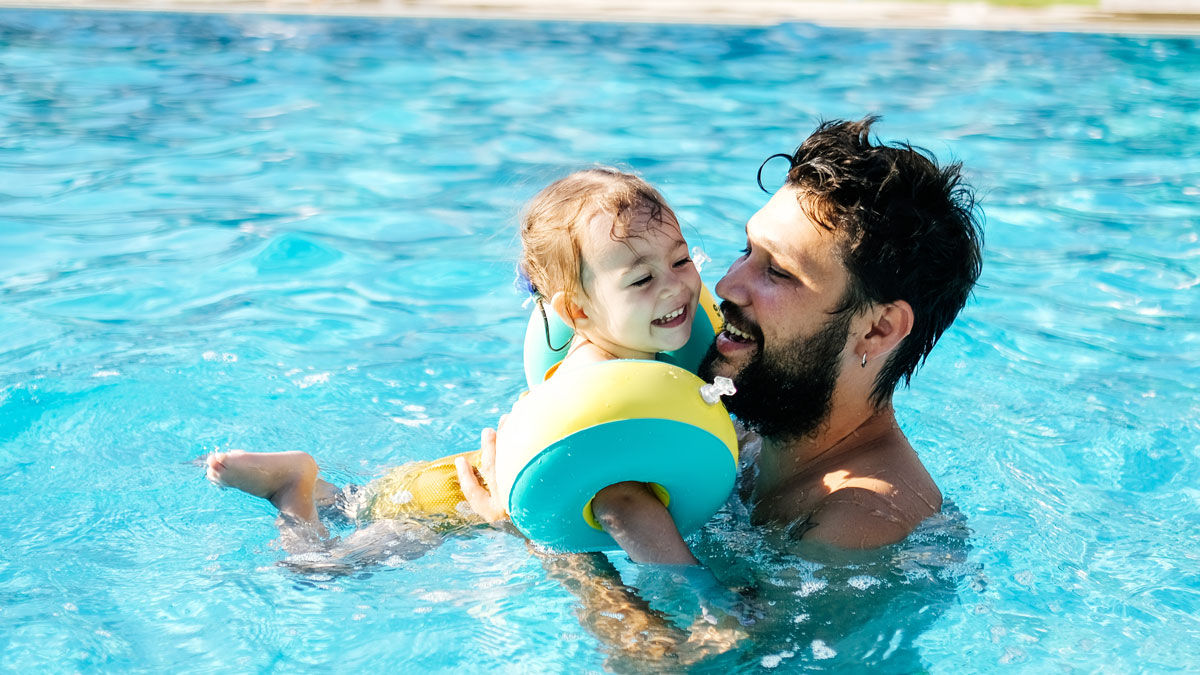 Young child swimming 